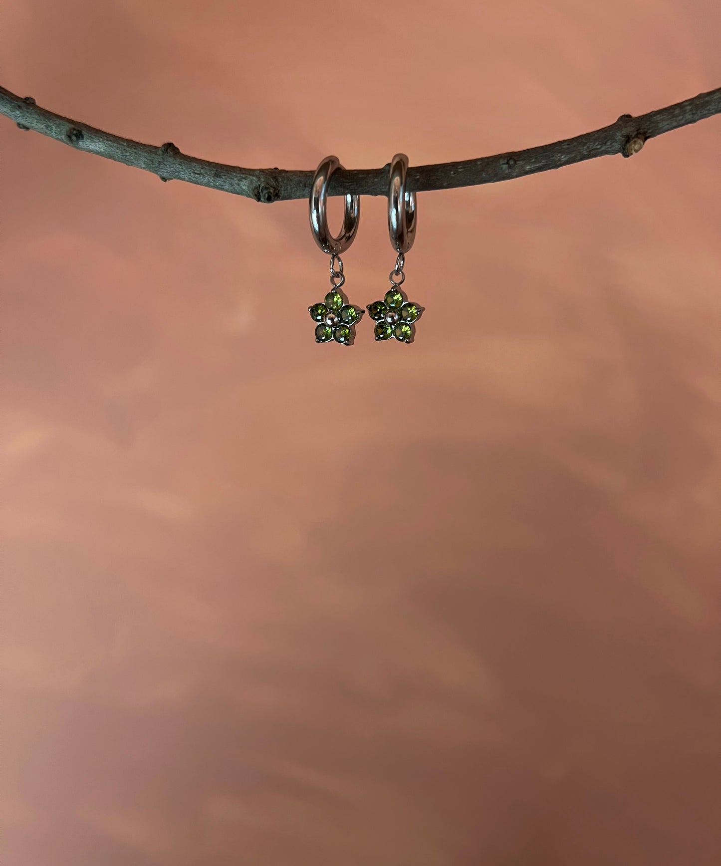 Silver earrings with green flower